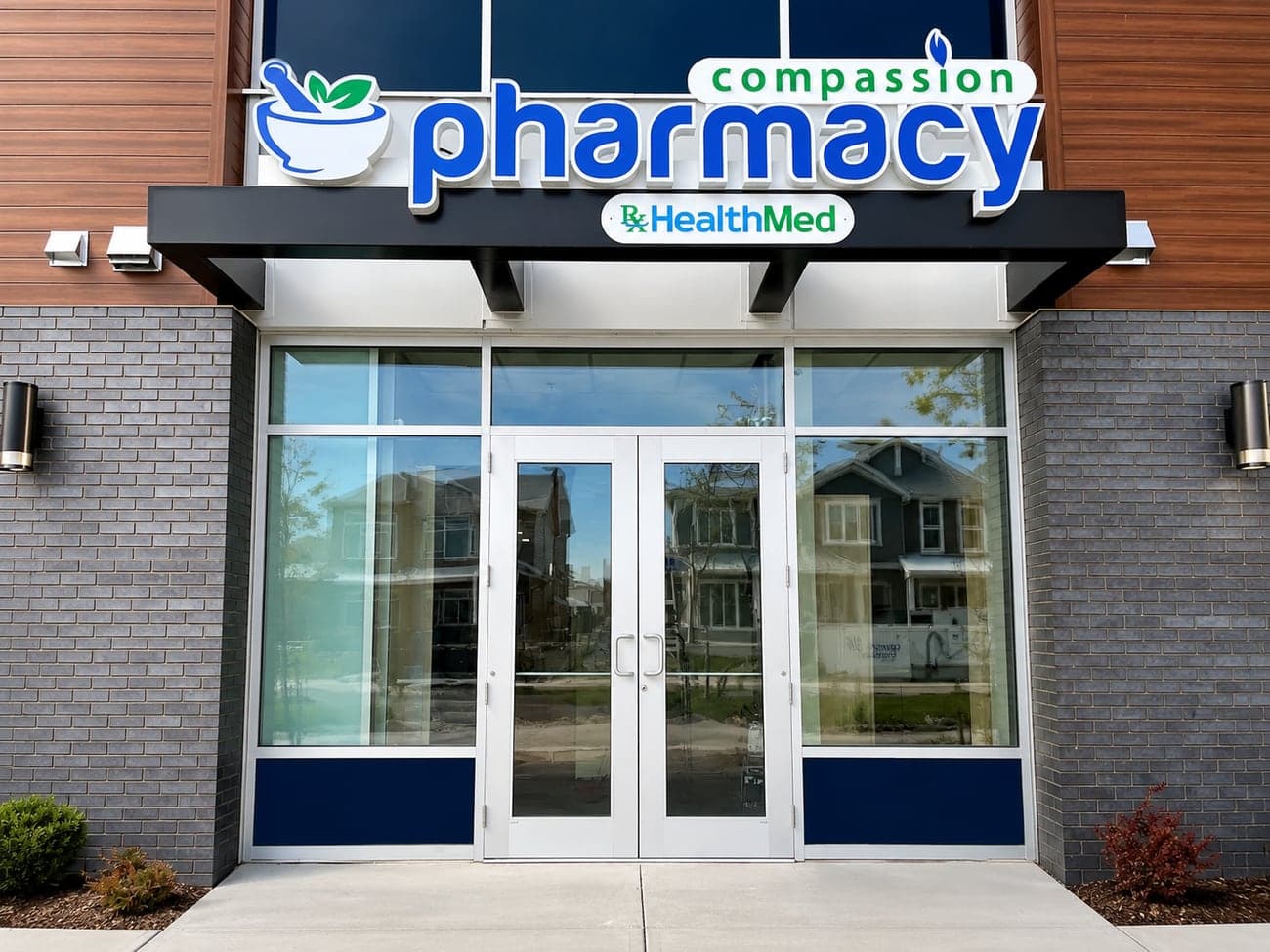 Pharmacist assisting a patient at Compassion Pharmacy